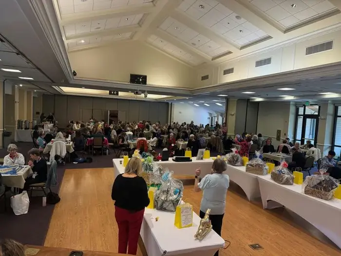 Fundraiser event with mahjong tables and raffle baskets