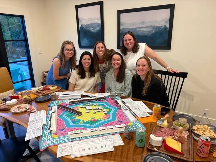 Kerri with students at a home mahjong night